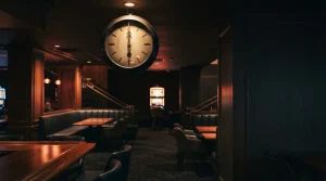 Unnumbered vintage clock at midnight in a warmly lit dark lounge, with a glowing slot machine in the background