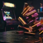 Glossy wooden blocks spinning across a dark tabletop, with a softly lit arcade cabinet and trophy shelf beyond