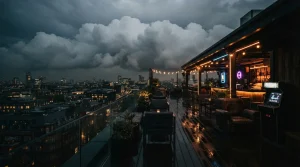 Billowing clouds above a rooftop lounge at dusk, with a vintage arcade cabinet glowing in warm neon light.