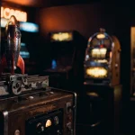 A small rocket poised on a launch track in a warm neon arcade, with a softly lit slot machine in the background