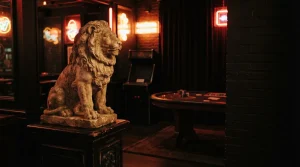 A sculpted stone lion beside a warmly lit arcade cabinet in a dark cinematic gaming lounge